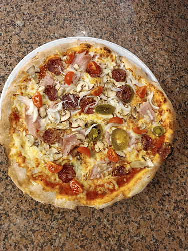 Pizzeria in burger house Domino