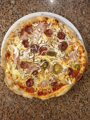 Pizzeria in burger house Domino